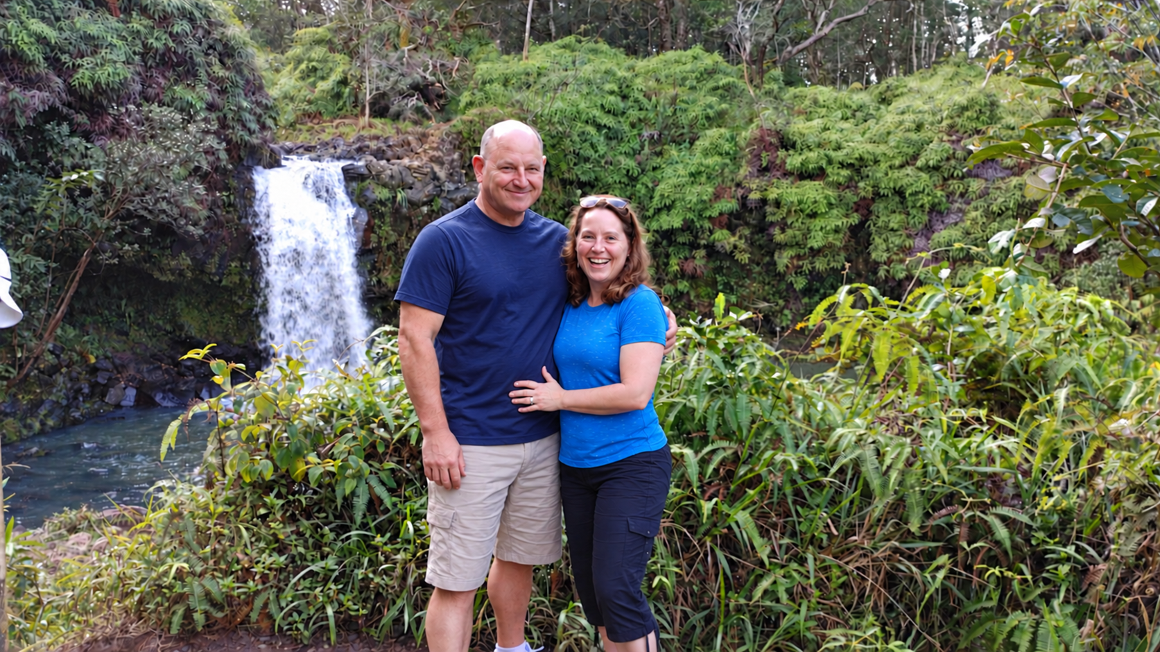 Greg and Adele enjoying a waterfall on their travels